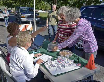 Volunteers helping at Pie in the Park fundraiser.